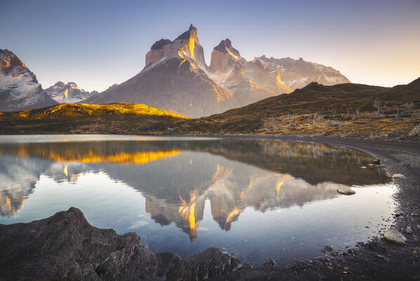 Cuernos del Paine reflected in Lake Nordenskjold during sunrise, Torres del Paine NP, Ultima Esperanza, Region de Magallanes y de la Antartica Chilena, Patagonia, Chile, South America