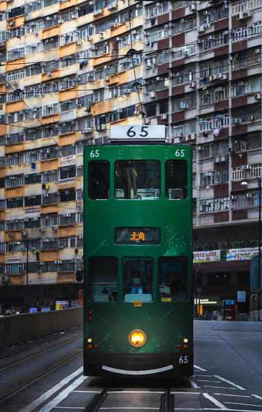 Green tram and Nam Tin building, North Point. Hong Kong, China, Asia
