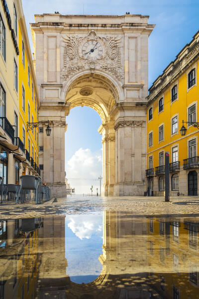 Reflection of the iconic Arco da Rua Augusta during sunrise, Baixa, Lisbon, Portugal, Iberian peninsula, Western Europe
