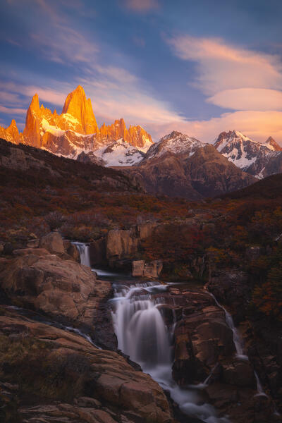 Escondida waterfall and Fitz Roy mountain in the background during sunrise, El Chalten, Parque Nacional Los Glaciares, Santa Cruz, Patagonia Argentina, Argentina, South America