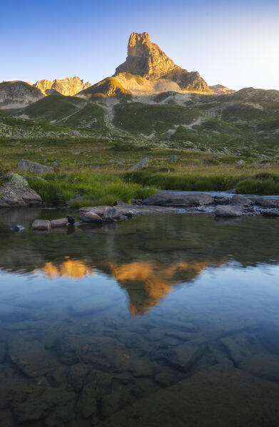 Grand Adret at sunset during summer reflected in the water, Provence Alps Cote d’Azur, Haute Alps, Vallee Etroite, France, Europe