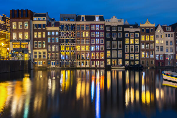 Illuminated Houses of Amsterdam along Damrak during blue hour, Amsterdam, Centrum, Nieuwe Zijde, Netherlands, North Holland, Western Europe