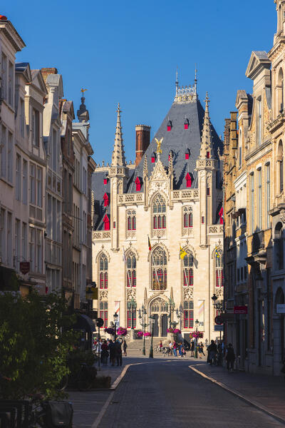 Provincial Court of Bruges framed by houses during sunset, Markt of Bruges, Belgium, West Flanders, Flanders, Western Europe