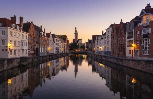 Illuminated Burghers Lodge and houses reflected in the canal at dusk, Bruges, Belgium, West Flanders, Flanders, Western Europe 