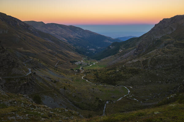 Pian della Regina viewed from Fiorenza lake during sunset, Crissolo, Cuneo, Piedmont, Italy, Southern Europe