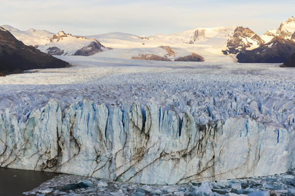 Glacier front of Perito Moreno viewed from a viewpoint during sunrise, Parque Nacional Los Glaciares, El Calafate, Santa Cruz, chilean antarctica region, Patagonia Argentina, Argentina, South America