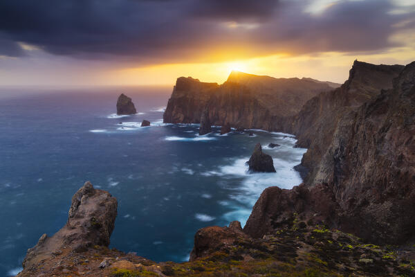 Warm light of the sunrise at Sao Lourenco peninsula from Canical viewpoint at Ponta do Rosto, Portugal, Western Europe