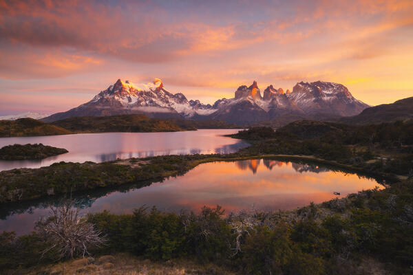 Lake Pehoe and Cuernos del Paine in the background during sunrise, Torres del Paine NP, Ultima Esperanza, Region de Magallanes y de la Antartica Chilena, Patagonia, Chile, South America