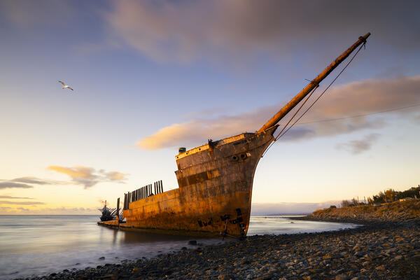 Strait of Magellan and ship wreck of Lord Lonsdale during sunrise, Punta Arenas, Magallanes, Region de Magallanes y de la Antartica Chilena, Patagonia, Chile, South America