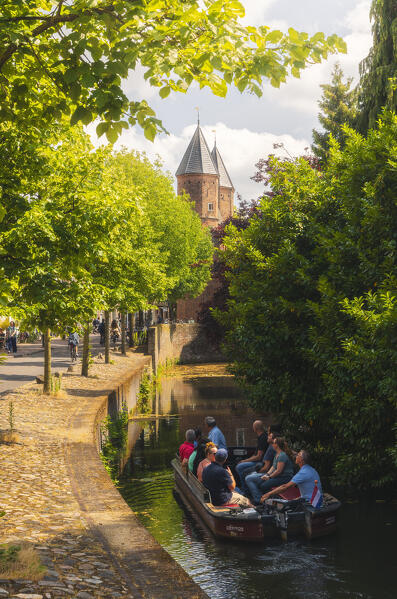 Tourists visit the town of Amersfoort by sailing on a boat along the canal during summer, Amersfoort, Netherlands, Utrecht, Western Europe