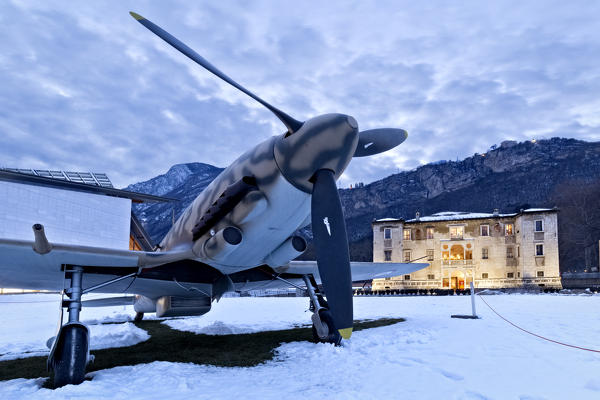 The Aermacchi 205 airplane and the Albere Palace in Trento. Trentino Alto-Adige, Italy, Europe.