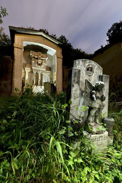 Gravestones in the ancient cemetery of the San Marziale church in Breonio. Lessinia, Fumane, Verona province, Veneto, Italy, Europe.