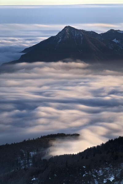 Monte Summano in the mists. Venetian pre-Alps, Vicenza province, Veneto, Italy.
