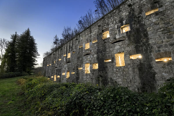 Night at Tagliata Bariola: Windowed facade of the 19th century Italian fortress. Valli del Pasubio, Veneto, Italy.
