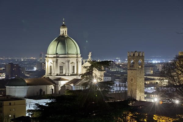 The Cathedral of Santa Maria Assunta and the Pegol Tower of Palazzo Broletto at sunset. Brescia, Lombardy, Italy.