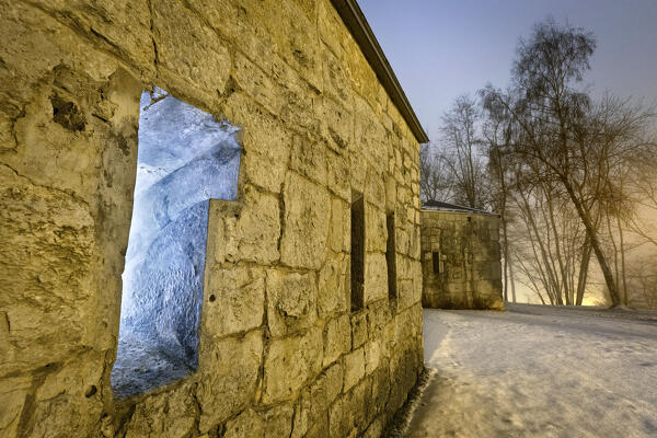 The Austro-Hungarian fort Roncogno on a snowy night. Cimirlo pass, Trento, Trentino, Italy.