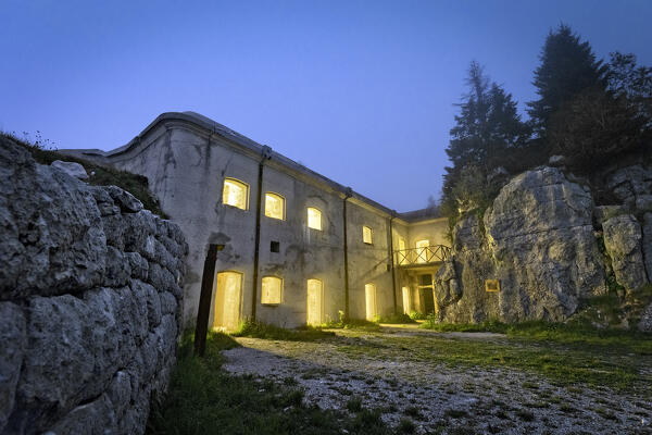 Fort Campolongo, historical site of the Great War, in the mists of the night. Rotzo, Sette Comuni plateau, Veneto, Italy.