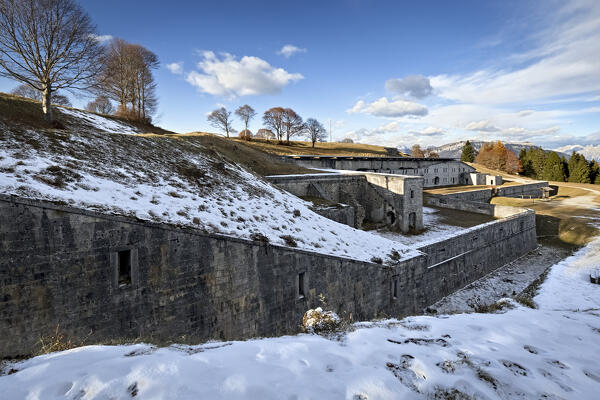 Entrance front of Fort Leone. In the foreground the wall and the ditch for close defense. Mount Cima Campo, Arsiè, Belluno, Veneto, Italy.