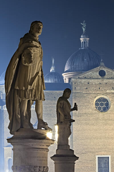 The statues of Prato della Valle and, in the background, the Abbey of Santa Giustina. Padua, Veneto, Italy.