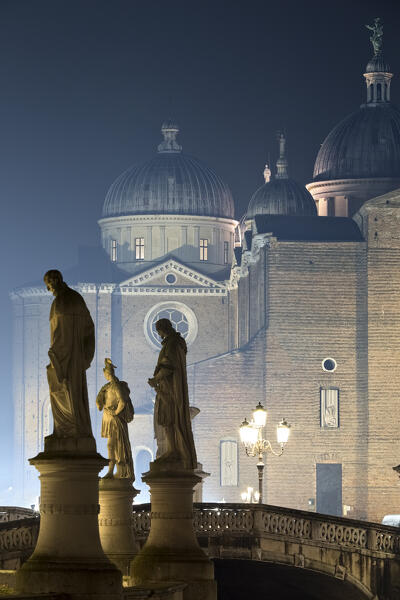 The statues of Prato della Valle and, in the background, the Abbey of Santa Giustina. Padua, Veneto, Italy.
