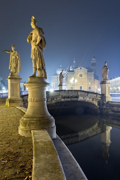The statues of Prato della Valle and, in the background, the Abbey of Santa Giustina. Padua, Veneto, Italy.