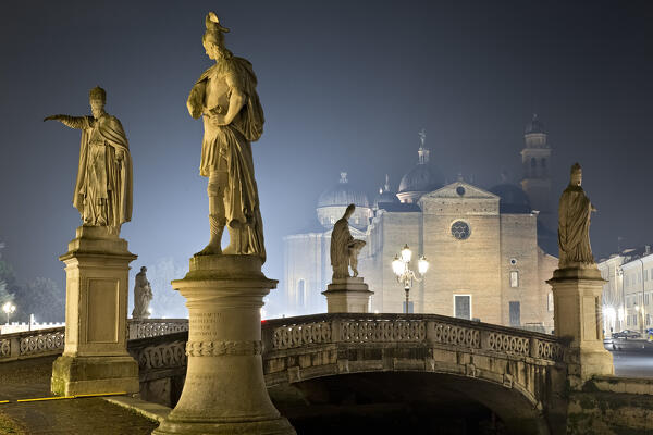 The statues of Prato della Valle and, in the background, the Abbey of Santa Giustina. Padua, Veneto, Italy.