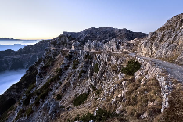 The Strada delle 52 Gallerie (Road of 52 tunnels), Pasubio massif, Vicenza Province, Veneto, Italy, Europe.
During the First World War the Italian army dug this incredible track along the cliffs and ridges of the mountain.