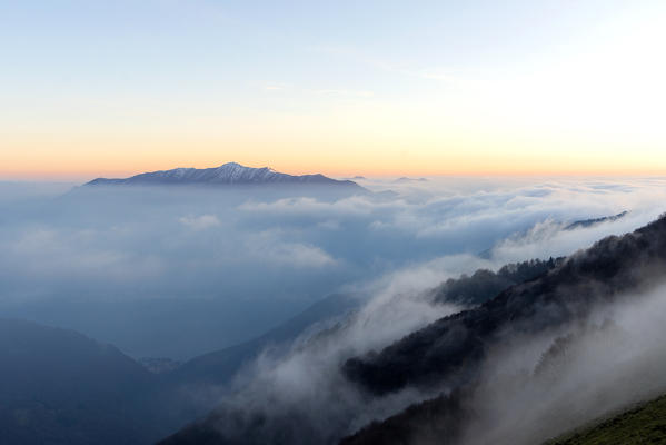 Monte Galbiga, Como province, Lombardy, Italy, Europe. Triangolo Lariano mountains emerging from a sea of clouds