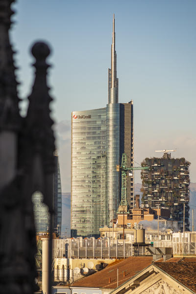 Milan, Lombardy, Italy, Europe. The Unicredit Tower and Bosco Verticale building seen from Milano Cathedral rooftop
