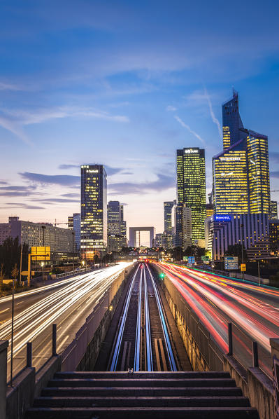 Arc de la Défence and La Défence Skyscaper during the night and cars’s lights (Paris, Ile-de-France, France, Europe)