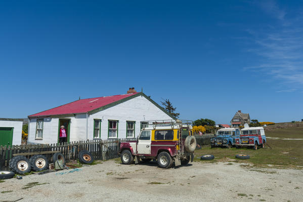 Land Rover cars in a  settlement near Cape Dolphin, Falkland Islands.