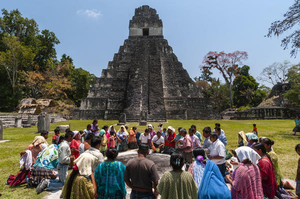 Mayan ritual in front of Temple I, Grand Plaza, Tikal mayan archaeological site, Guatemala.