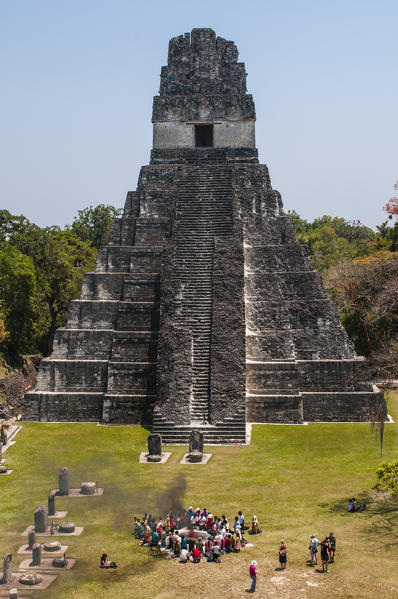 Mayan ritual in front of Temple I, Grand Plaza, Tikal mayan archaeological site, Guatemala.