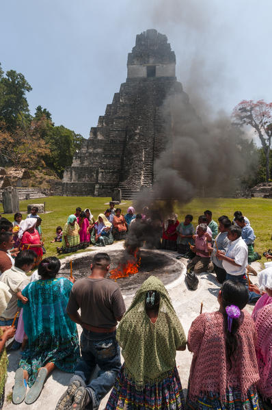 Mayan ritual in front of Temple I, Grand Plaza, Tikal mayan archaeological site, Guatemala.