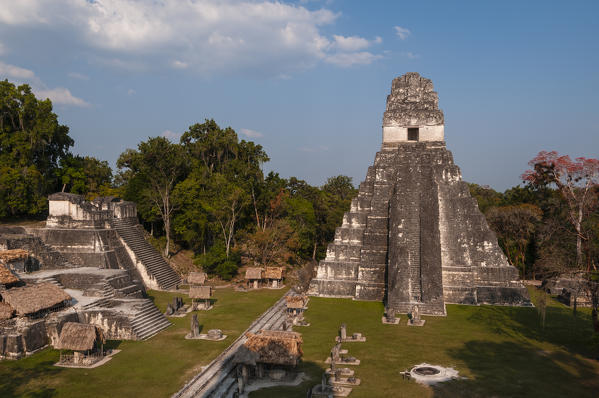 Gran Plaza, view of northern acropolis and Temple I, Tikal mayan archaeological site, Guatemala.