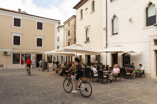 Outdoor cafes in Manziolijev square, Isola, Slovenia.