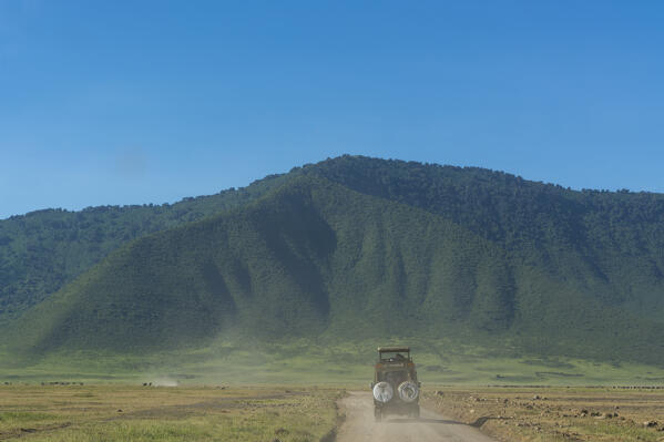 Safari vehicle in the Ngorongoro crater, Ngorongoro Conservation Area, Serengeti, Tanzania.