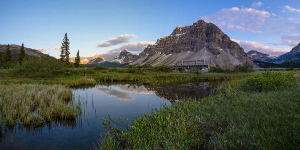 Canada, Alberta, Icefields Parkway, Banff National Park, Bow Lake: shy clouds reflecting in the lake at sunset