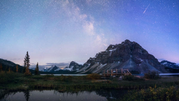 Canada, Alberta, Icefields Parkway, Banff National Park, Bow Lake: the Milky Way over the mountains reflecting into the lake