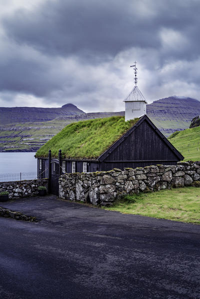Europe, Denmark, Faroe Islands, Eystoroy, Gjogv: a classic little church on the coastline
