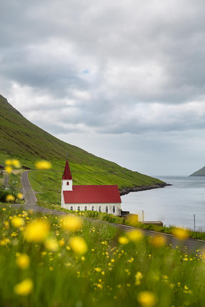 Europe, Denmark, Faroe Islands, Kunoy: a classic little church on the coastline