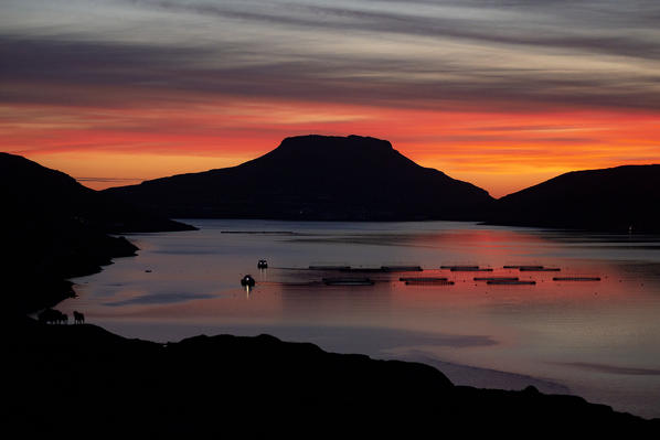 Europe, Denmark, Faroe Islands, Streymoy: midnight sun on islands silhouettes