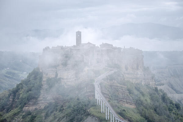 Europe, Italy, Umbria: morning fog on Civita di Bagnoregio