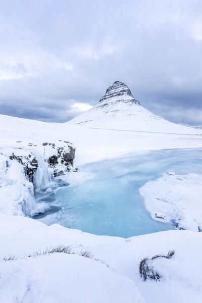 Europe, Iceland: Snaefellsnes peninsula: frozen waterfall under the Kirkjufell