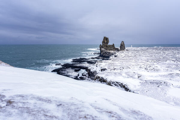 Europe, Iceland: the Londrangar rock pinnacles and the Malarrif lighthouse