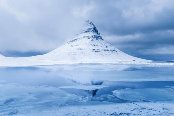 The iconic Kirkjufell mountain reflecting: Snafellsnes Peninsula, Western Iceland, Europe