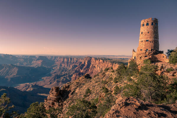 Amazing sunset from Desert View with the Watchtower kissed by the last light of the day; South Rim of the Grand Canyon National Park, Arizona, United States of America