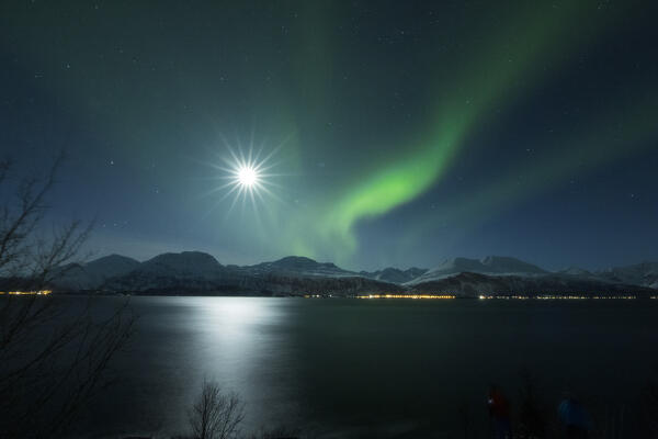 Classical view of Lofoten Islands, the northern lights reflecting into the fjord's water: Europe, Norway 