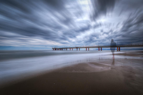 Long exposure on a cloudy day at the pier of Marina di Pietrasanta, Lucca province, Versilia, Tuscany, Italy, Europe