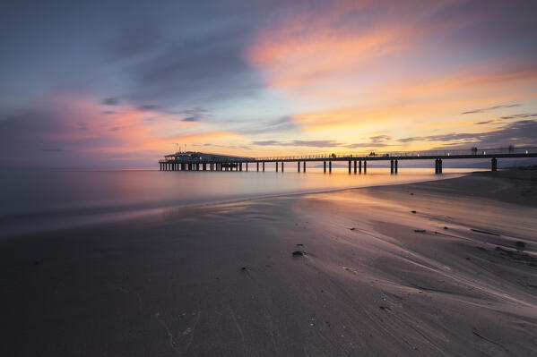 Long exposure at sunset on the pier of Lido di Camaiore, Lucca province, Versilia, Tuscany, Italy, Europe